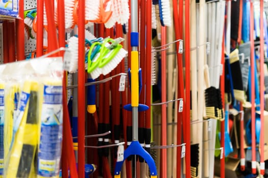 Large assortment of brushes for cleaning premises in store. Trade in floor cleaning equipment