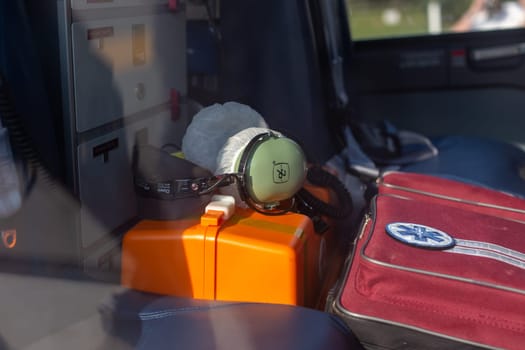 Moscow, Moscow region, Russia - 03.09.2023:An aviation headset and emergency medical gear stored inside a rescue helicopter, highlighting preparedness for aerial medical services
