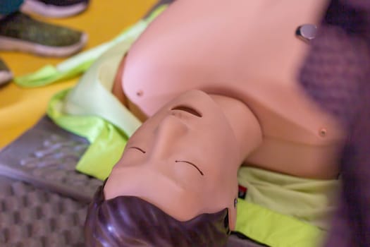 Close-up view of a CPR training mannequin used for demonstrating lifesaving techniques in a first aid course