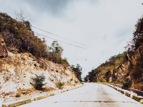 Bright sunshine day time Highway curve road overpass nature landscape background street tall lanterns trees bushes sideway.