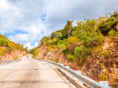 Bright sunshine day time Highway curve road overpass nature landscape background street tall lanterns trees bushes sideway.