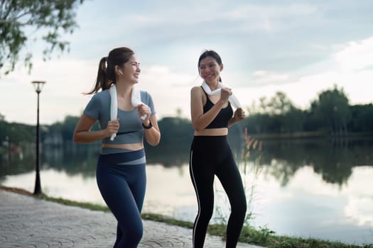female friend go to exercise together at village park in evening, working out for health.