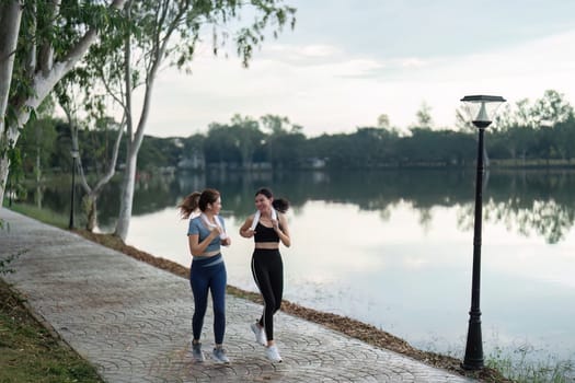 female friend go to exercise together at village park in evening, working out for health.