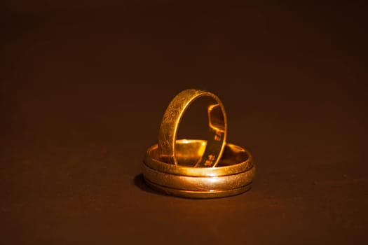 The well worn wedding bands of a couple celebrating many decades of marraige