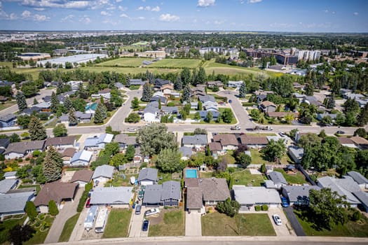 Drone image capturing the charm of River Heights, Saskatoon, with its lush landscapes and residential areas.