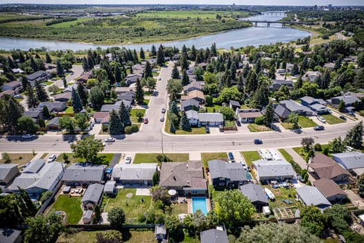 Drone image capturing the charm of River Heights, Saskatoon, with its lush landscapes and residential areas.