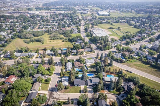 Drone image capturing the charm of River Heights, Saskatoon, with its lush landscapes and residential areas.