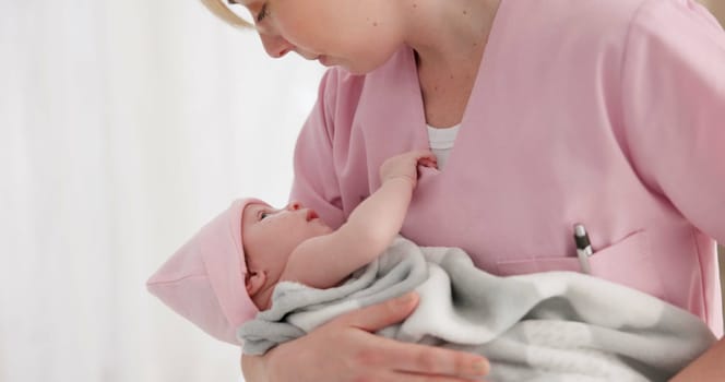 Nurse, woman and newborn in hospital for wellness, medical checkup or examination with support or care. Pediatrician, professional and holding baby in clinic with bond and relax for child development.