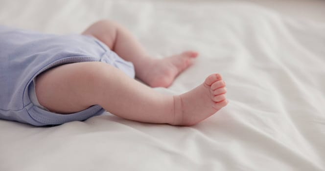 Adorable, family and feet of baby on bed for child care, relax and resting in nursery. Innocent, cute and closeup of toes of innocent newborn infant for health, wellness and development at home.
