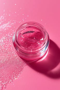 Shimmering pink cosmetic gel in a clear jar set against a pink background, ideal for beauty, skincare, and makeup promotions or as a vibrant backdrop. Generative AI