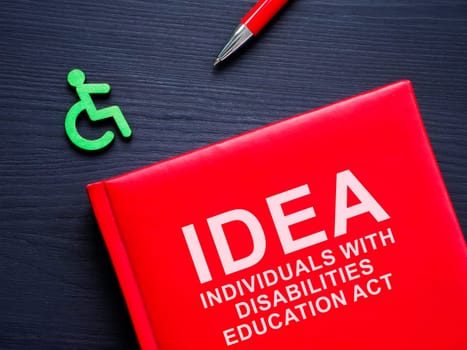 Book IDEA Individuals with disabilities education act and pen.
