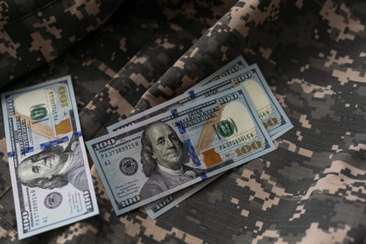 American dollars banknotes on military pixel background. High quality photo