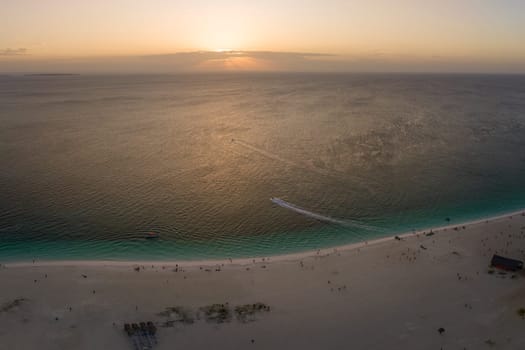 Zanzibar beach,beautiful sunset at the beach in Tanzania, Africa. Turquoise sea, orange sky