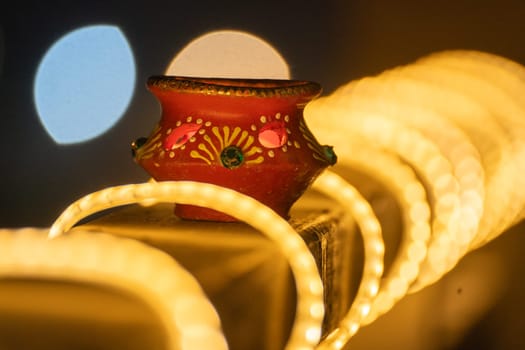 beautifully decorated diyas surrounded by light loops lit on the eve of diwali and the Ram temple Pran Pratishtha consecration celebrated across India and globally by hindu devotees