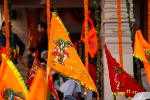 Ayodhya, Uttar Pradesh, India - 22nd Jan 2024:Zoomed shot showing crowd of people carrying flag celebrating the Pran Pratishtha consecration of Ram mandir temple massive celebration in India