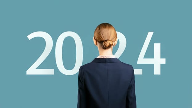 business woman with the new year 2024 . Businesswoman look at 2024 white color letter over blue background, Business happy new year 2024 cover concept. High quality image