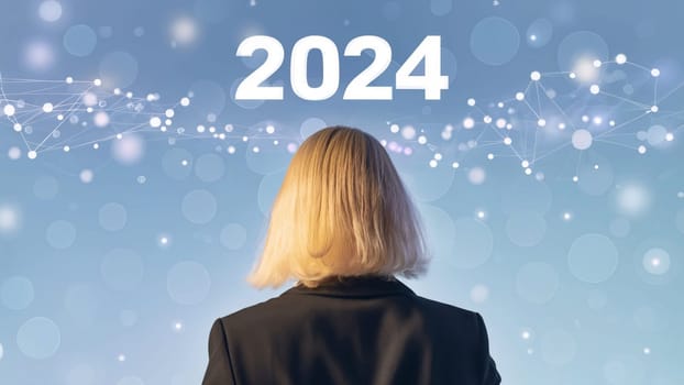 business woman with the new year 2024 for her eyes. Businesswoman look at 2024 white color letter over future network background, Business happy new year 2024 cover concept. High quality image