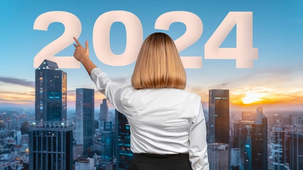 business woman with the new year 2024 for her eyes. Businesswoman point 2024 white color letter over futuristic city in sunset background, Business happy new year 2024 cover concept. High quality image