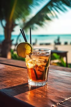 Refreshing cocktail on wooden bar with ocean backdrop.