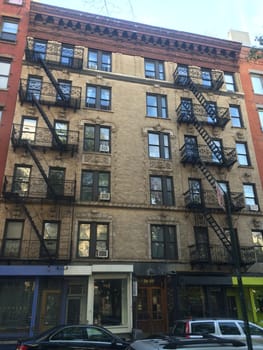 Apartment Building with Fire Escapes in Midtown Manhattan, New York City, USA. High quality photo