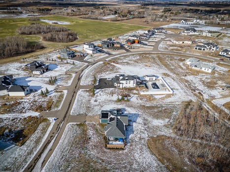 Drone image showcasing the beauty of Grasswood Estates in Saskatoon, Saskatchewan, with its spacious residential properties and natural surroundings