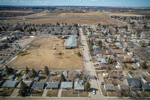Overhead drone image of Sutherland, Saskatoon, highlighting its unique community layout and residential areas.