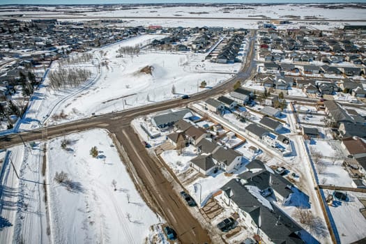 Drone image capturing the town of Martensville in Saskatchewan during the winter season, with its snow-covered streets, cozy homes, and charming winter scenery