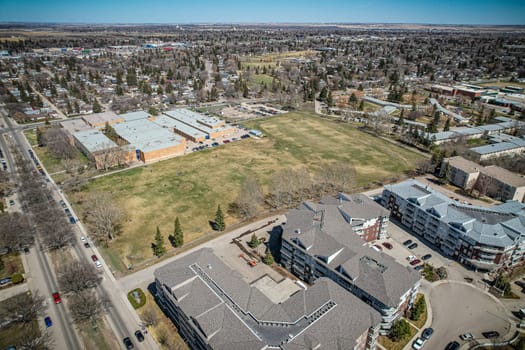 Drone image of Nutana Suburban Centre, Saskatoon, highlighting its urban layout and community spaces.