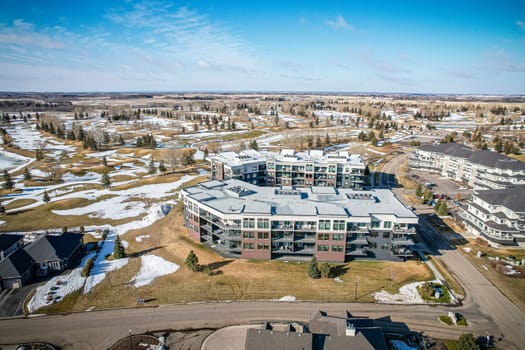 Drone image of The Willows, Saskatoon, highlighting its luxury homes and golf course.