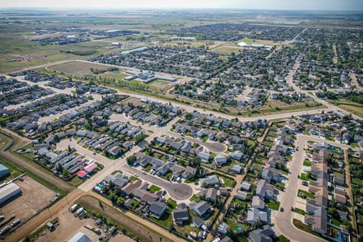 Drone image capturing the town of Martensville in Saskatchewan during the summer season, highlighting its suburban and residential areas surrounded by lush greenery