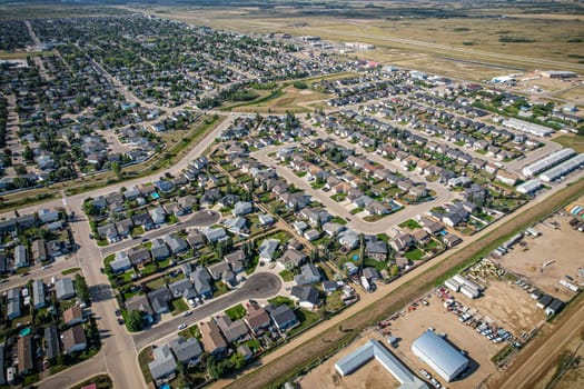 Drone image capturing the town of Martensville in Saskatchewan during the summer season, highlighting its suburban and residential areas surrounded by lush greenery