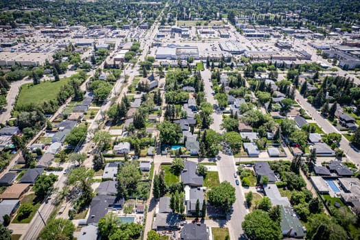 Drone image showcasing the charm of Grosvenor Park, Saskatoon, with its residential areas, greenery, and community spaces.