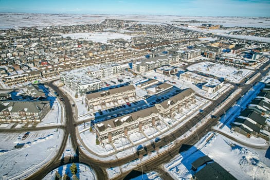 Drone capture of Evergreen, Saskatoon, highlighting its unique layout and lush green spaces.