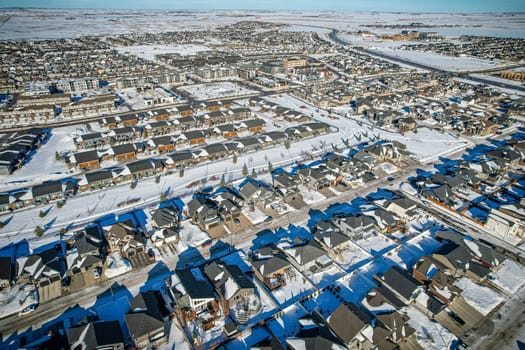 Drone capture of Evergreen, Saskatoon, highlighting its unique layout and lush green spaces.