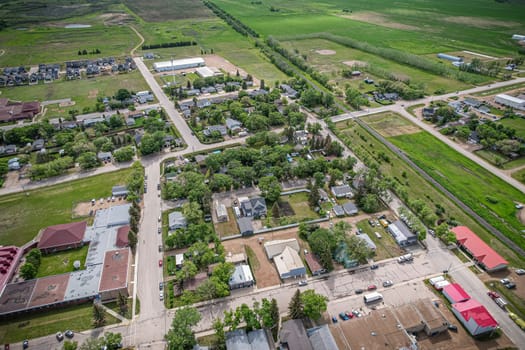 Drone image capturing the town of Dalmeny in Saskatchewan during the summer season, showcasing its vibrant greenery and serene atmosphere