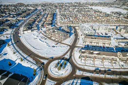 Drone capture of Evergreen, Saskatoon, highlighting its unique layout and lush green spaces.