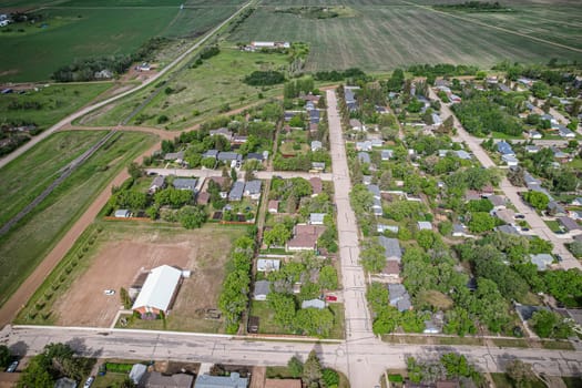 Drone image capturing the town of Dalmeny in Saskatchewan during the summer season, showcasing its vibrant greenery and serene atmosphere