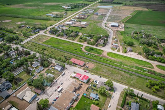 Drone image capturing the town of Dalmeny in Saskatchewan during the summer season, showcasing its vibrant greenery and serene atmosphere