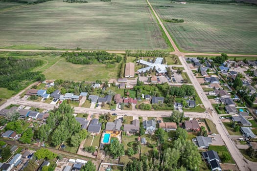 Drone image capturing the town of Dalmeny in Saskatchewan during the summer season, showcasing its vibrant greenery and serene atmosphere