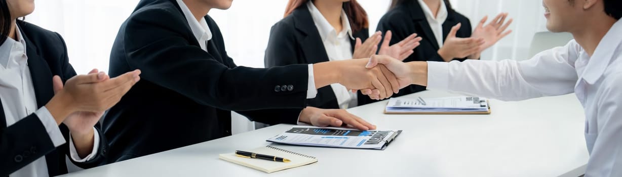 Business people group handshake at meeting table. Job interview success or making successful business oratory agreement