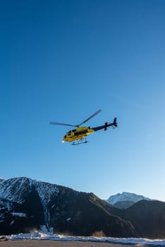 Arinsal, Andorra: 2024 January 21: Rescue helicopter at the 2024 Ski Mountaineering World Cup at the Pal - Arinsal ski resort in 2024.