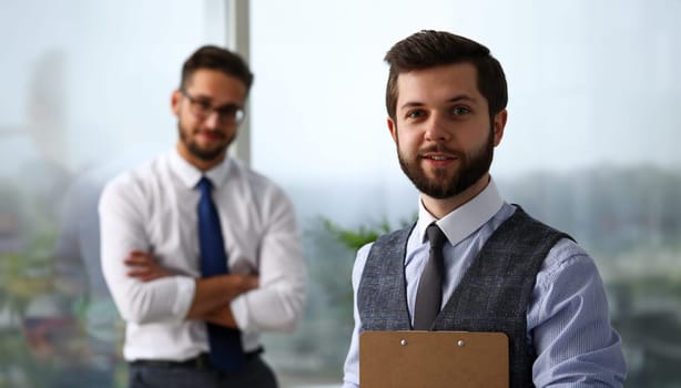 Handsome smiling bearded clerk man at workplace look in camera portrait. White collar staff dress code worker job offer office client visit study profession boss market idea coach training