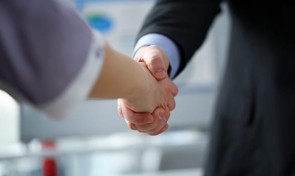 Man in suit and tie give hand as hello in office closeup. Friend welcome mediation offer positive introduction thanks gesture summit participate executive approval motivation male arm strike bargain