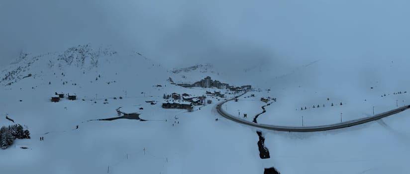 Blizzard Over French Alps Mountains. Aerial Time Lapse Over snowy and bad weather mountain. Harsh Wild Environment. Natural Phenomena in Tignes. Winter Landscape In Grey White