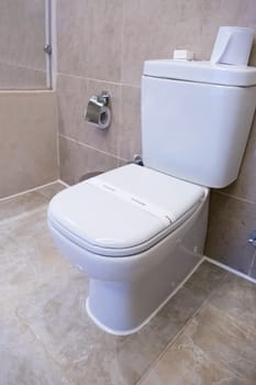 Ceramic toilet bowl with paper line hygiene text