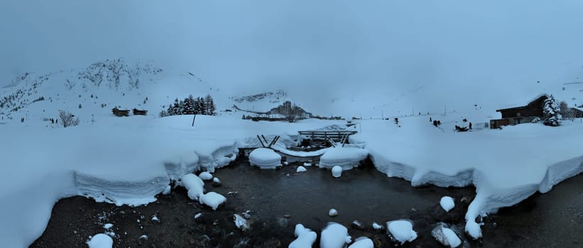 Winter drone shot of ski pistes and slopes covered with fresh powder snow in Tignes in Valdisere France. Alps aerial panoramic view on a beautiful sunny day ski lift snowboarding and skiing in resort