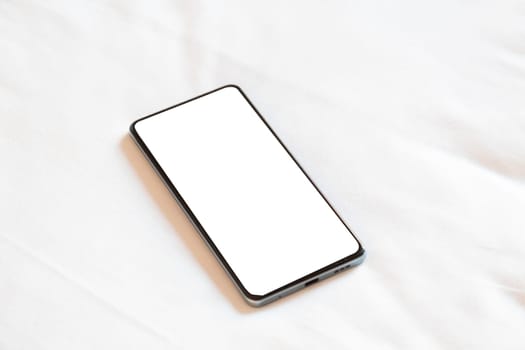 Travel concept. smartphone screen mockup on bed