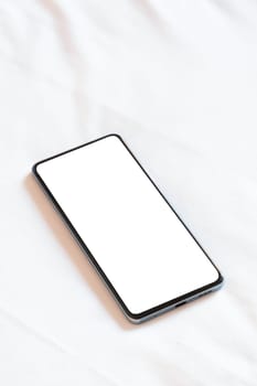 Travel concept. smartphone screen mockup on bed