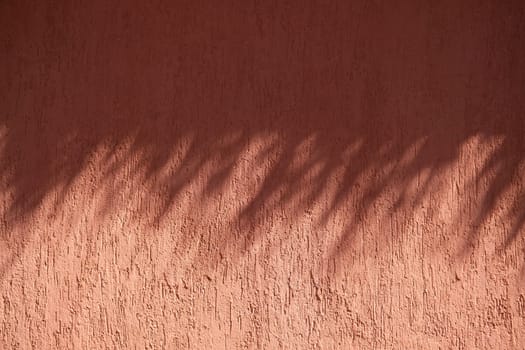 terracotta background textured wall with shadow overlay