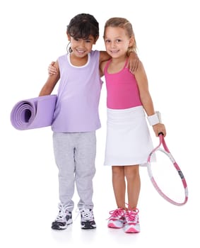 Tennis, sports and portrait of kids hug on a white background for training, workout and exercise. Fitness, happy and isolated young children with racket, yoga mat and equipment for wellness in studio.